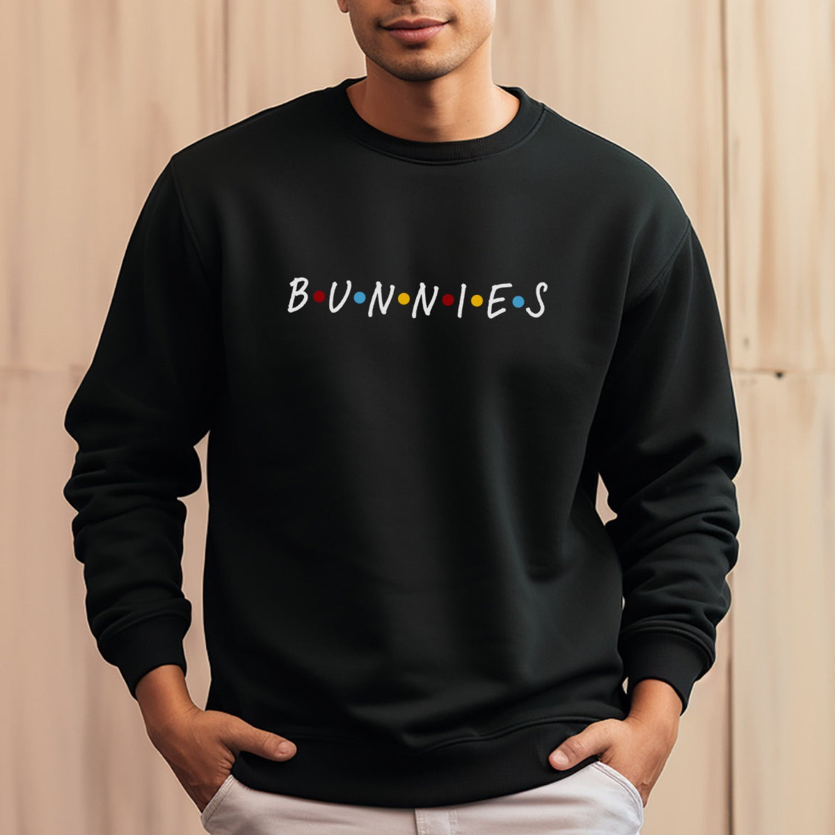 Man wearing a black sweatshirt with the text Bunnies on it.